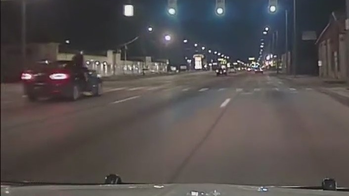 Video released of gunman who opened fire on Detroit police officers hanging out of car
